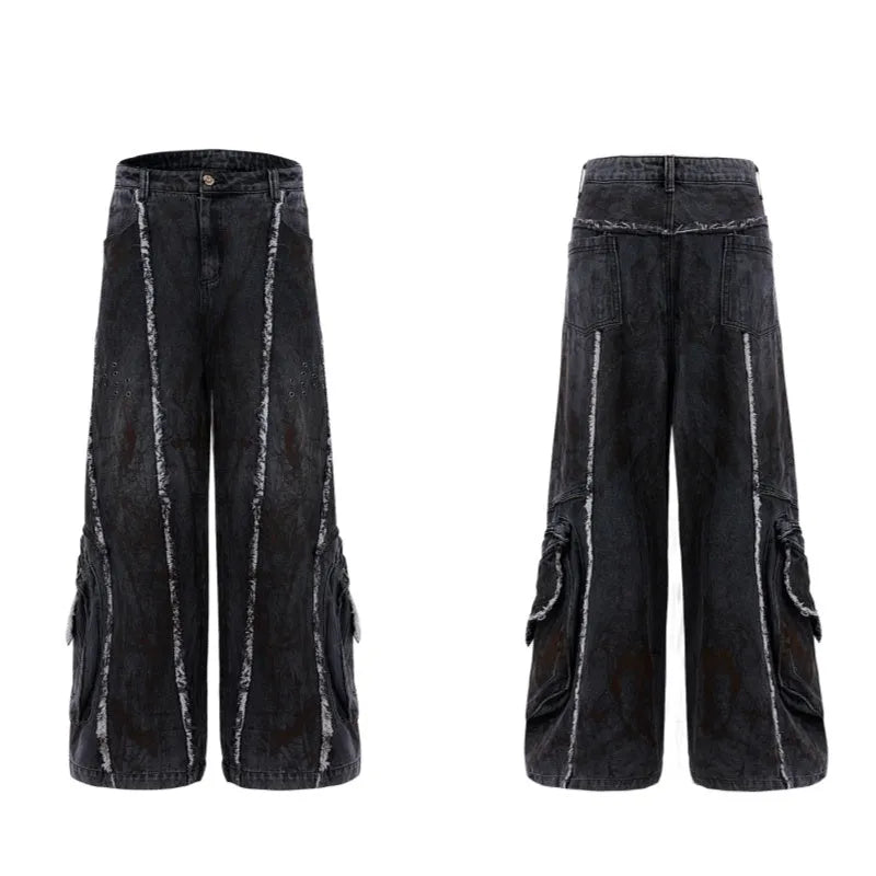 Black gradient distressed denim coat with padded shoulders and matching trousers, featuring raw edges and splash-dye finish.
