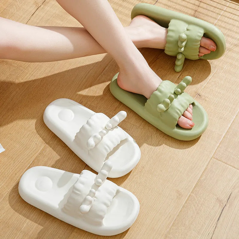 Women's white EVA flip flop slippers with raised deer horn design on the upper and a textured non-slip sole.