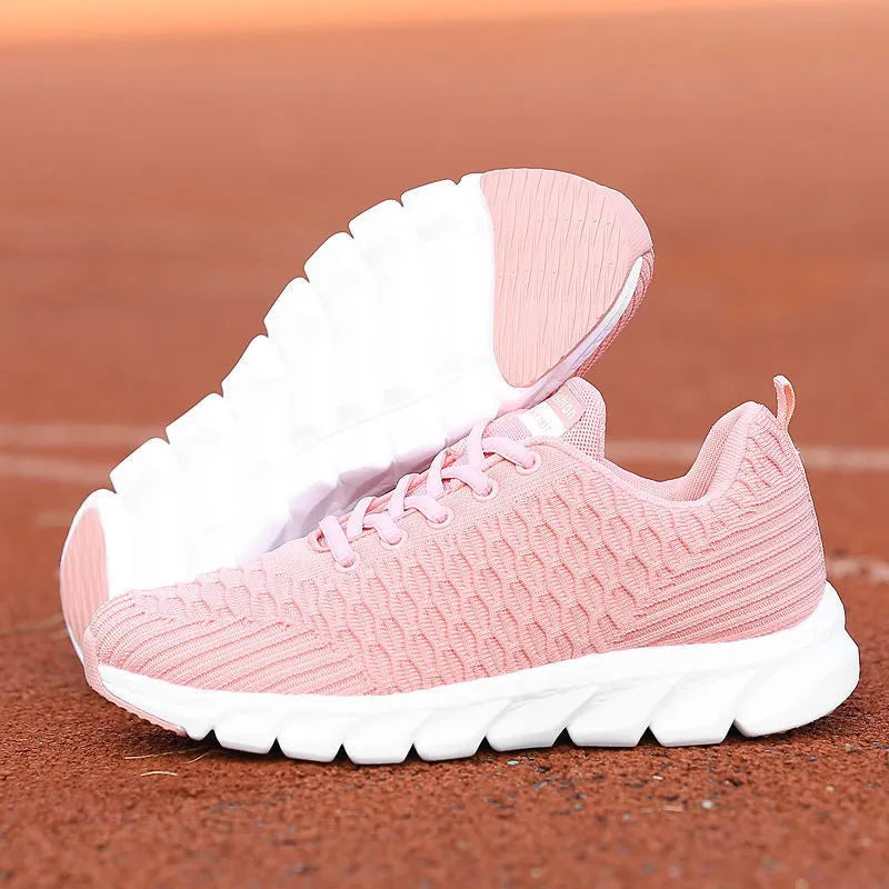 Women's running shoes with fly weaving upper in black, pink, or white colours showing breathable construction