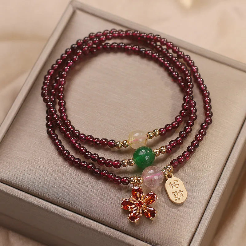 Natural crystal bracelet in pomegranate red and cherry blossom colours with sequin bead accents for women
