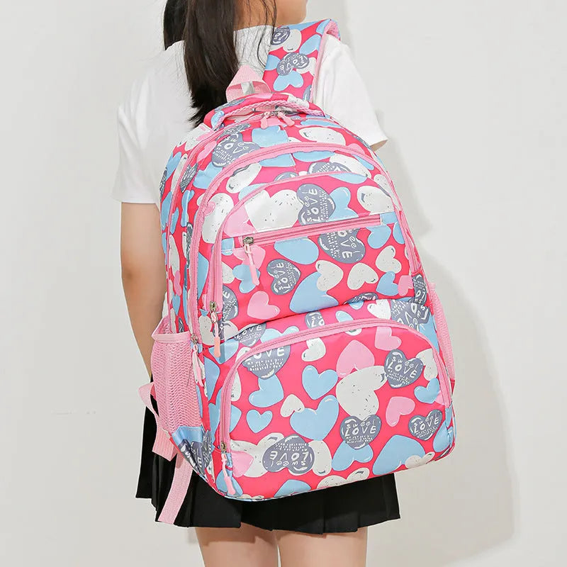 Blue student schoolbag with air pillow belt straps and large main compartment.