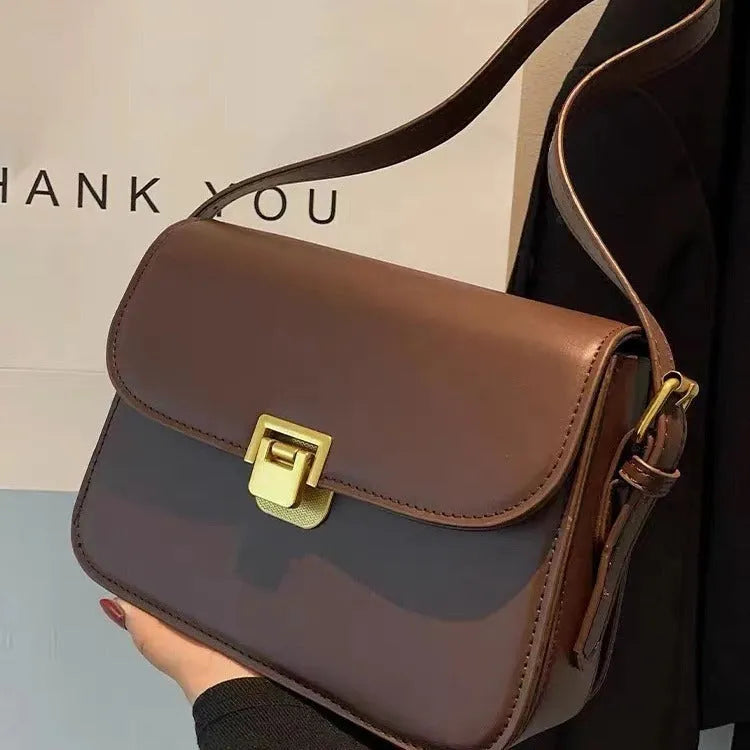 Soft PU leather women's small square shoulder bag in black with one-shoulder underarm carry design