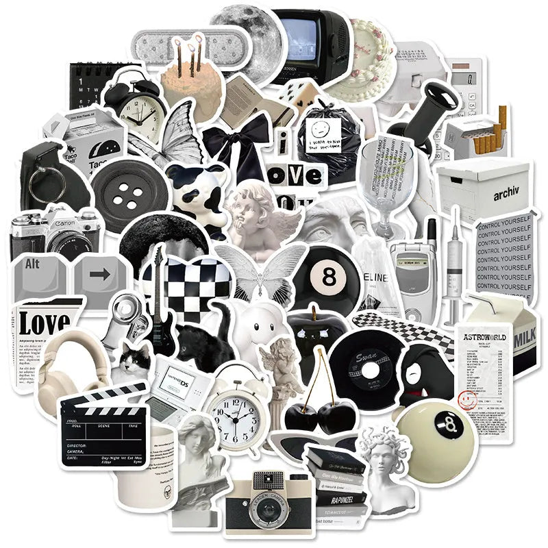 Assortment of black and white vinyl stickers featuring coffee cups and abstract designs for laptops and phones.