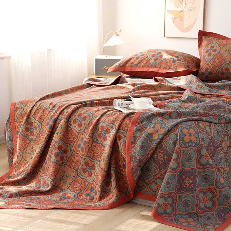 Three-piece cotton gauze bed blanket set with botanical floral pattern showing blanket and two pillowcases
