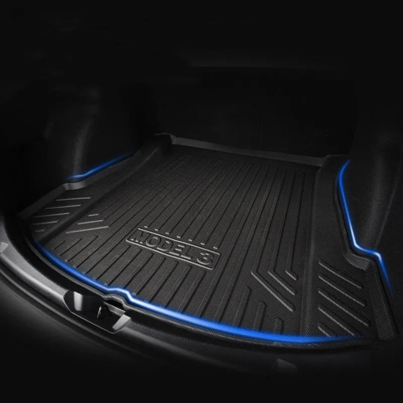 Custom rubber floor mats for Tesla cars, showing TPE footrest section and model-specific contours.