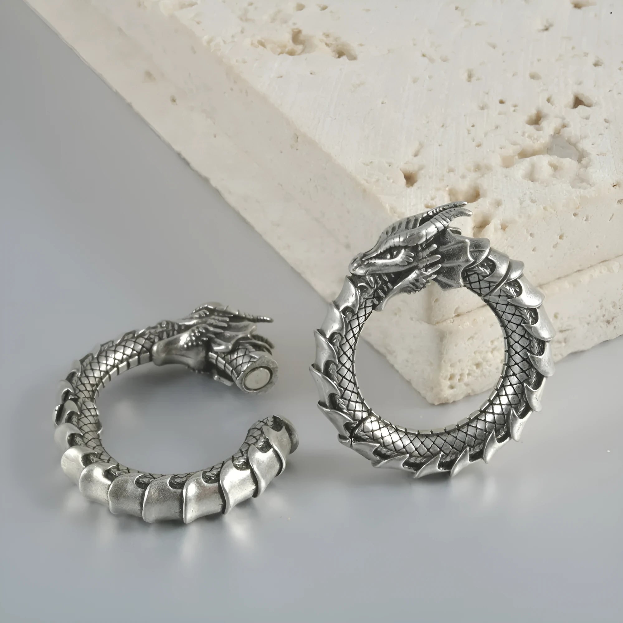 Large antique silver dragon-shaped hollow-out auricle earrings made from stainless steel.