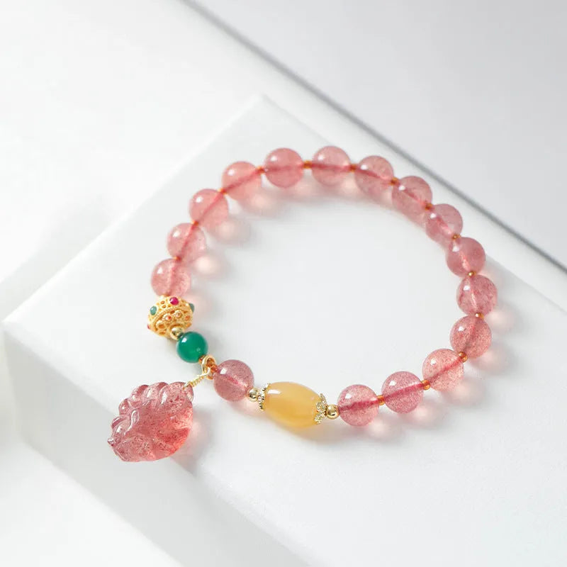 Women's crystal bracelet with strawberry quartz beads and nine tail fox charm