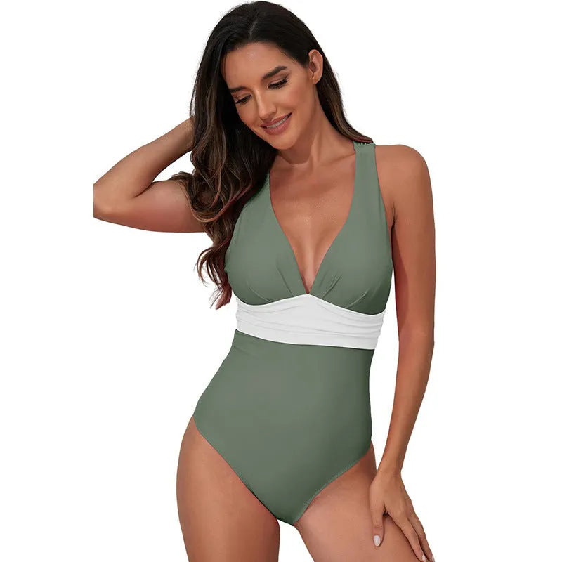 Women's solid colour cross-shoulder one-piece swimsuit in minimalist design for swimming activities
