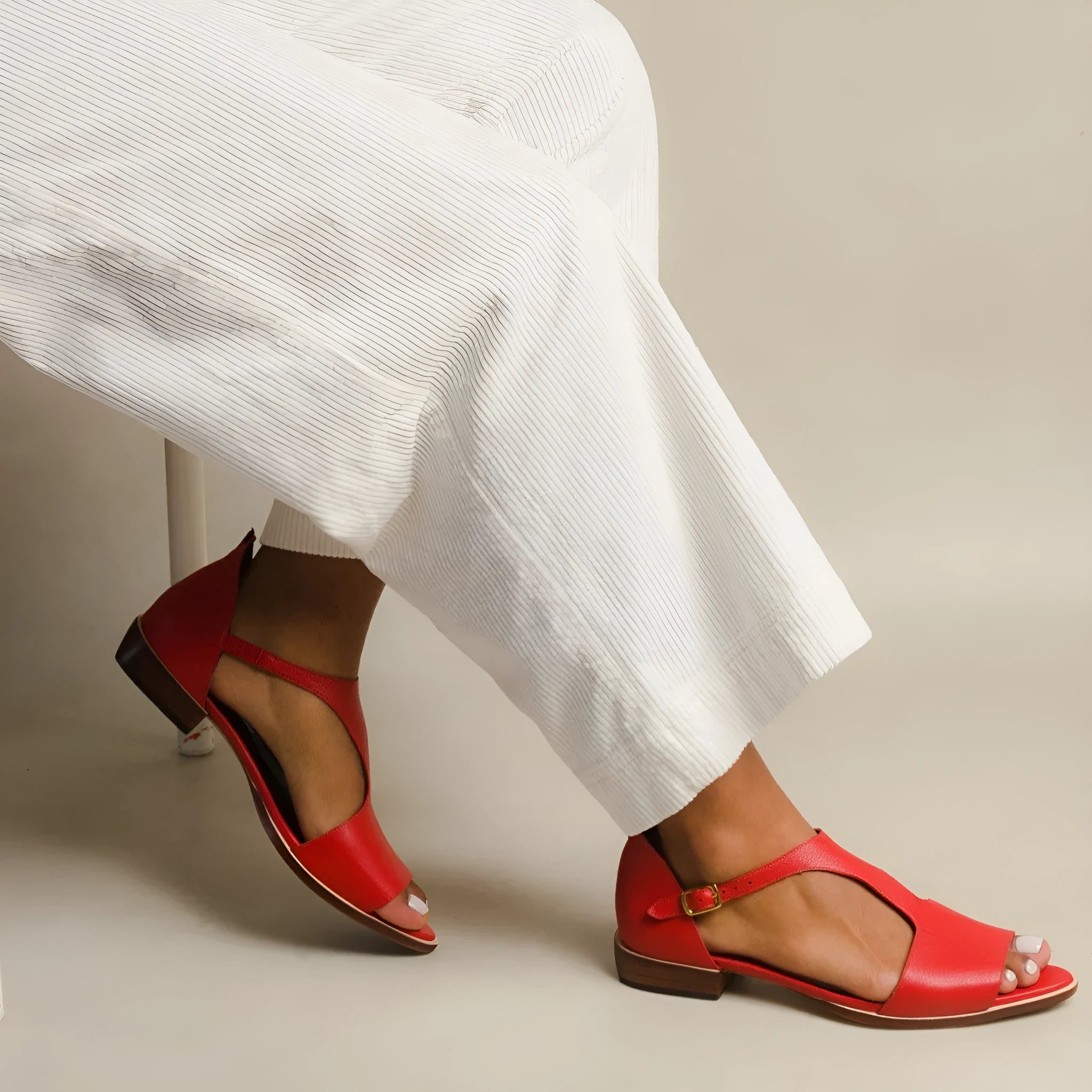 Red women's sandals with square buckle and herringbone toe holder in artificial PU material