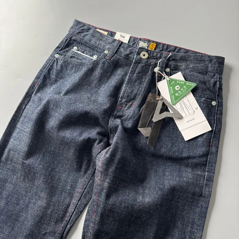 Men's straight leg denim jeans in a primary colour, showing front view of the mid waist and classic cut.