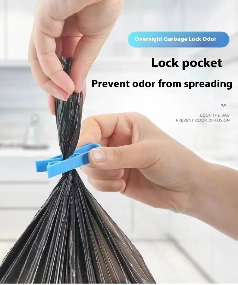Green and black non-slip plastic clip for holding a bin bag on a wheelie bin rim.