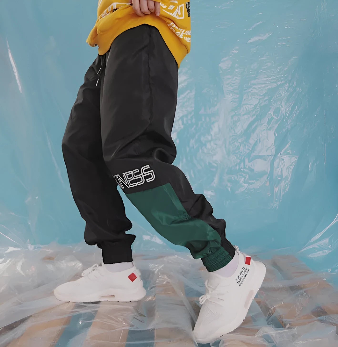 Japanese hip hop trousers with hit colour stitching, letter print, and bouquet foot detail in green low-waist drawstring style