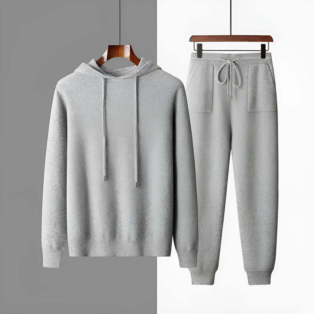 Men's light grey cashmere-blend hooded sweatshirt and matching joggers laid flat.