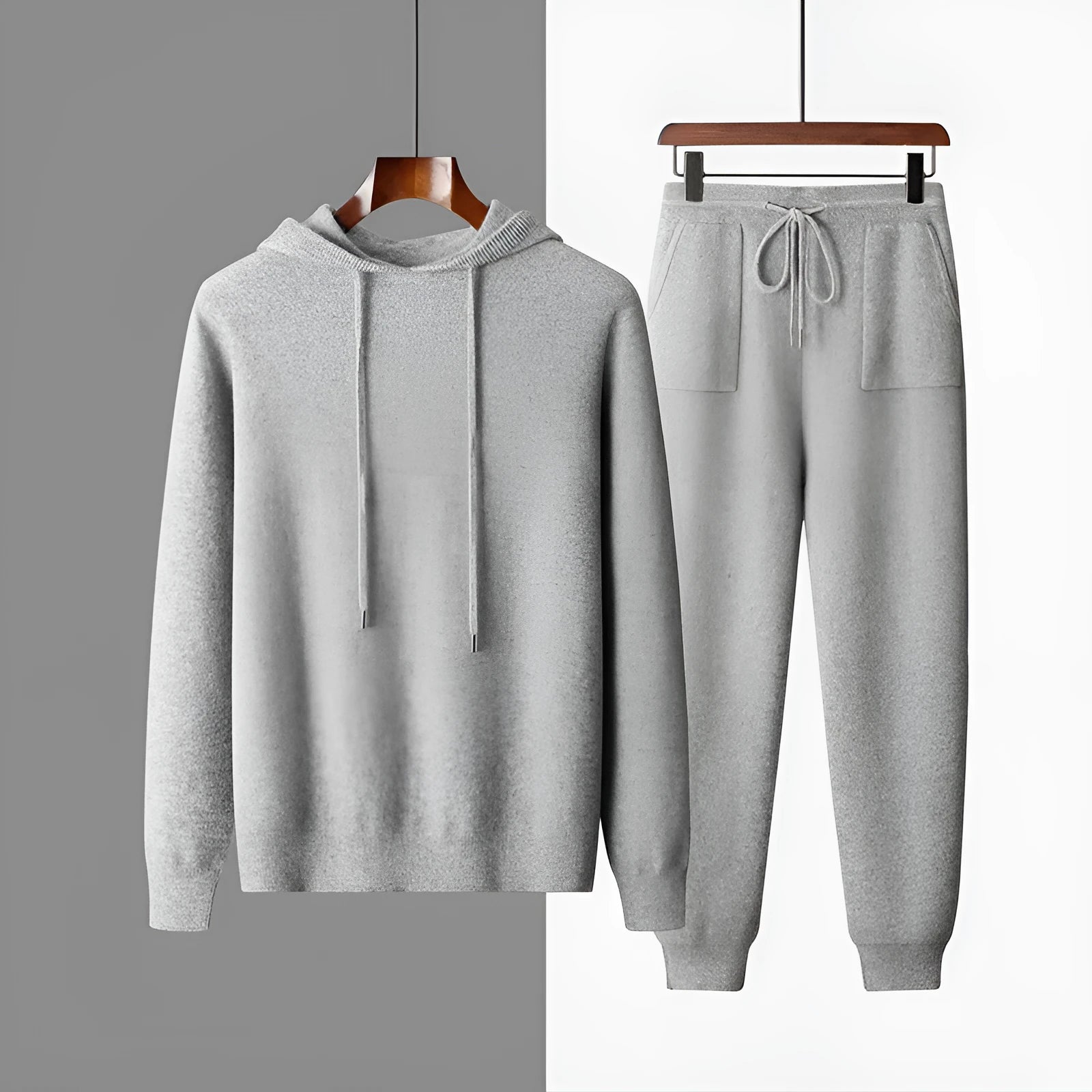 Men's light grey cashmere-blend hooded sweatshirt and matching joggers laid flat.