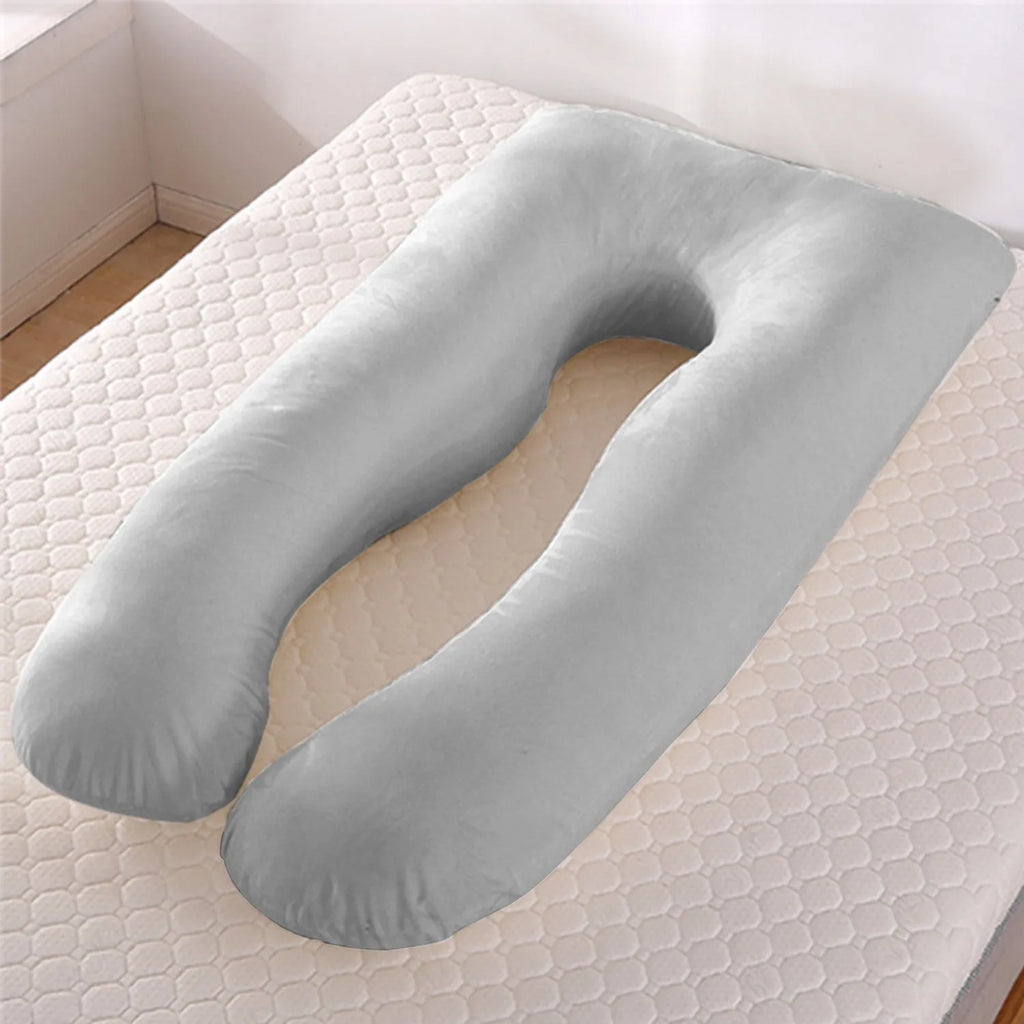 U-shaped pregnancy pillow in light blue ice silk fabric on a bed.