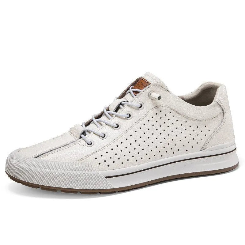 Men's white and black leather round toe flat casual trainers on a plain background.