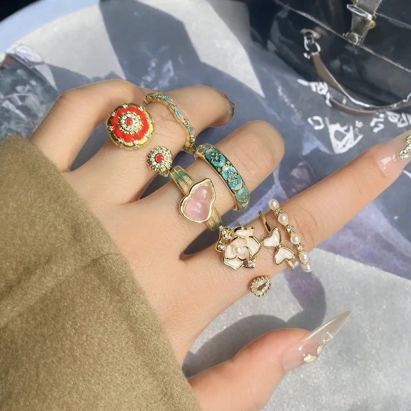 Adjustable copper gourd ring with inlaid zircon stones in New Chinese style featuring floral and bow designs
