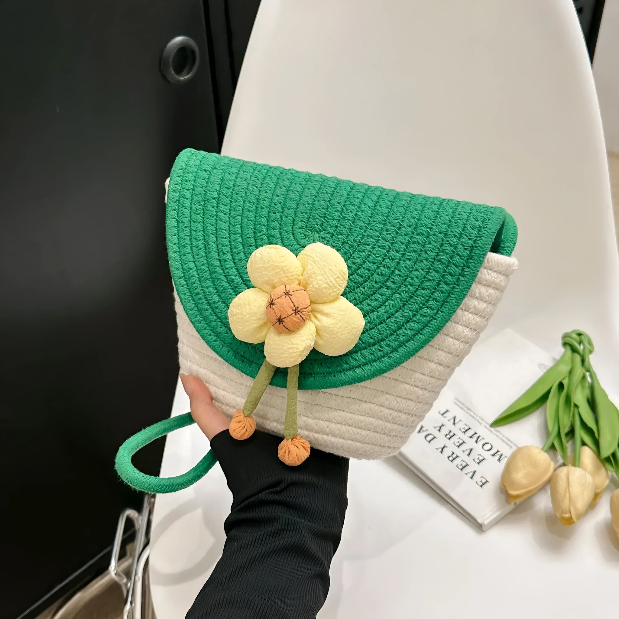 Women's cotton linen straw bucket bag with handwoven flower detail, crossbody strap, five colour options