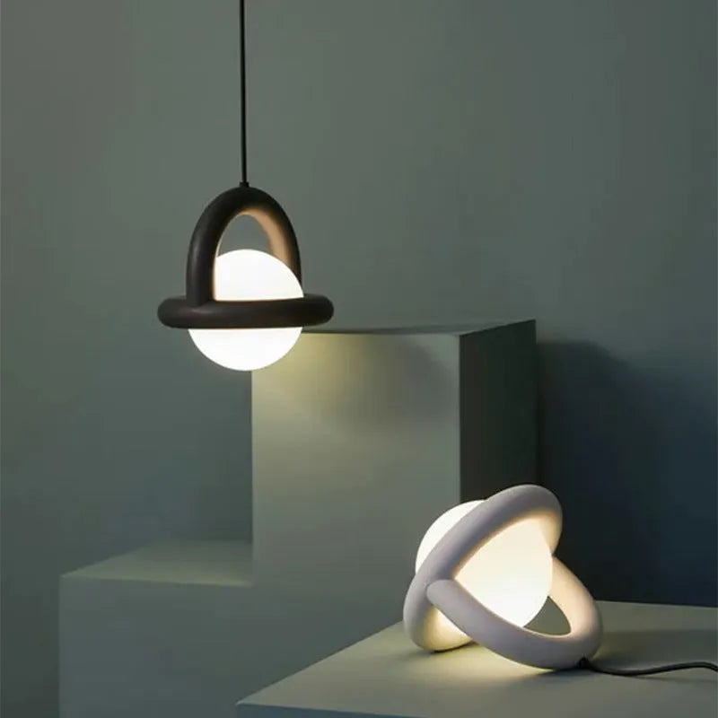 Danish designer Nordic style linear hanging pendant lamp in a choice of colours including green, mounted on a wall.