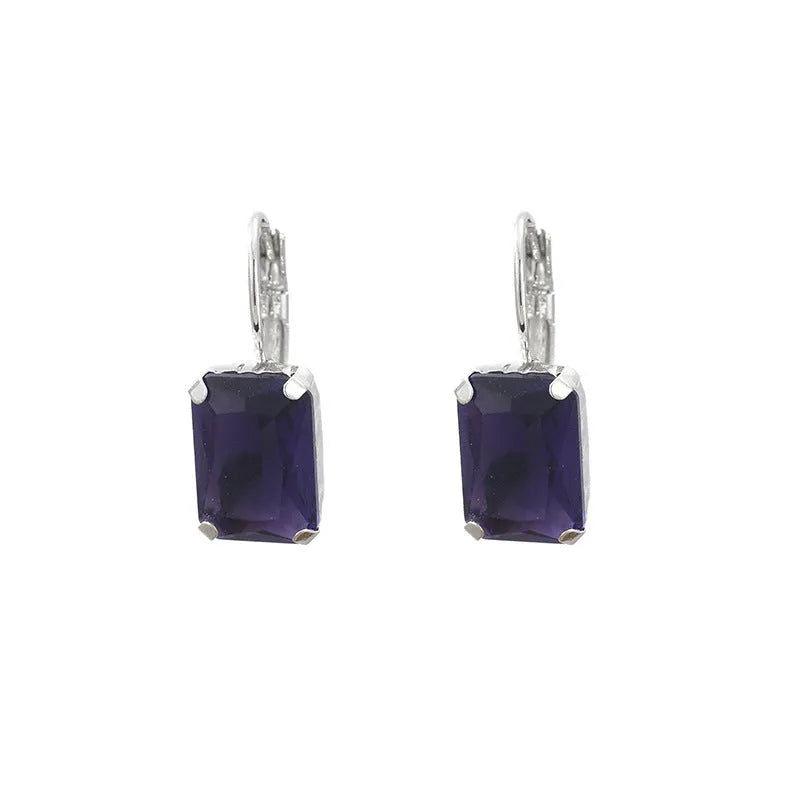 Women's square crystal earrings in red, yellow, and purple colours with copper construction