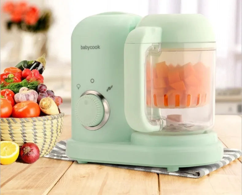 Baby food processor with steamer and blender functions in green or pink colours