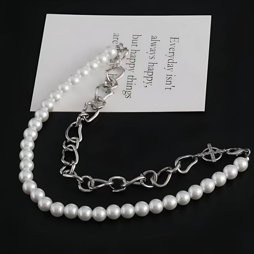 White geometric asymmetric acrylic fashion necklace with a twisted chain design.