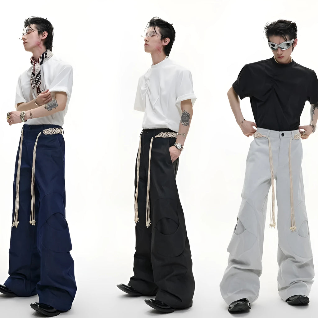 Men's dark coloured straight-leg jeans with heavy 3D cutting, belt-loop stitching, and decorative zipper details