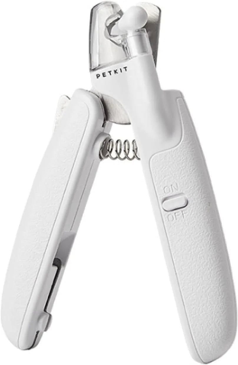 White pet nail clippers with LED light on blade and transparent anti-splash guard, shown with a nail file.