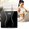 Black electronic bathroom scales with digital display showing weight measurement up to 180kg capacity