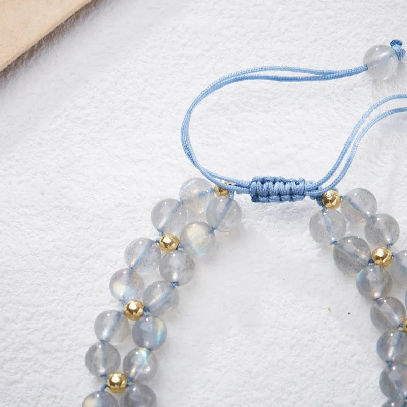 Handmade geometric woven bracelet for women with a grey moonstone and butterfly design.