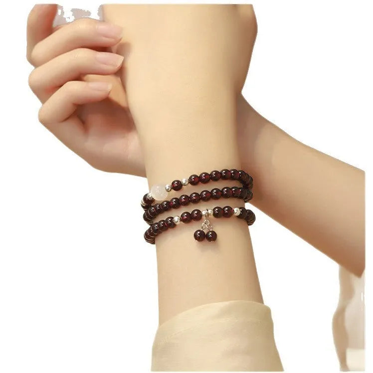 Chinese-style garnet bracelet with U-shaped design and pomegranate elements in antique style