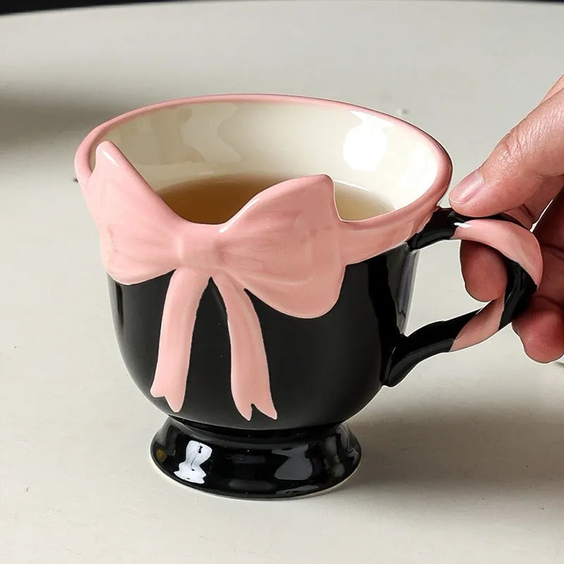 Ceramic mug with heart bow design in black pink colour, 301-400 ml capacity
