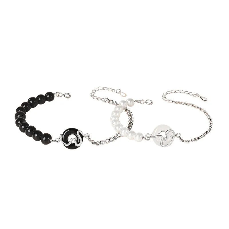 925 sterling silver couple bracelet with safety buckle, obsidian pearl, and Chinese zodiac snake design.