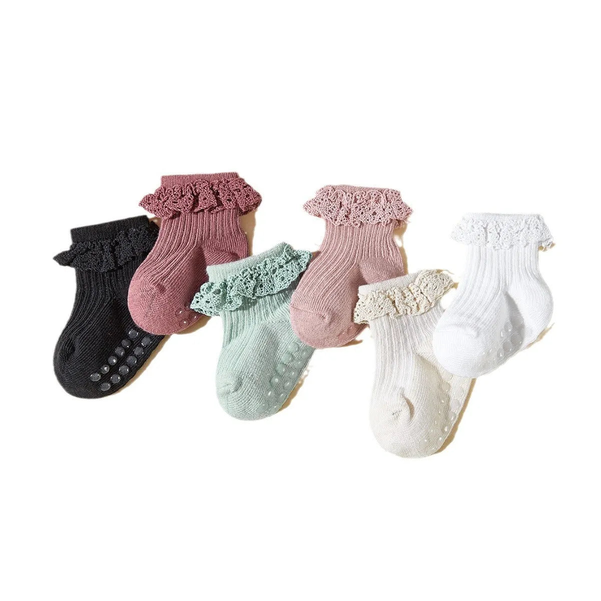 Six pairs of baby girl lace cotton tube socks in mixed colours, short tube length, on white background