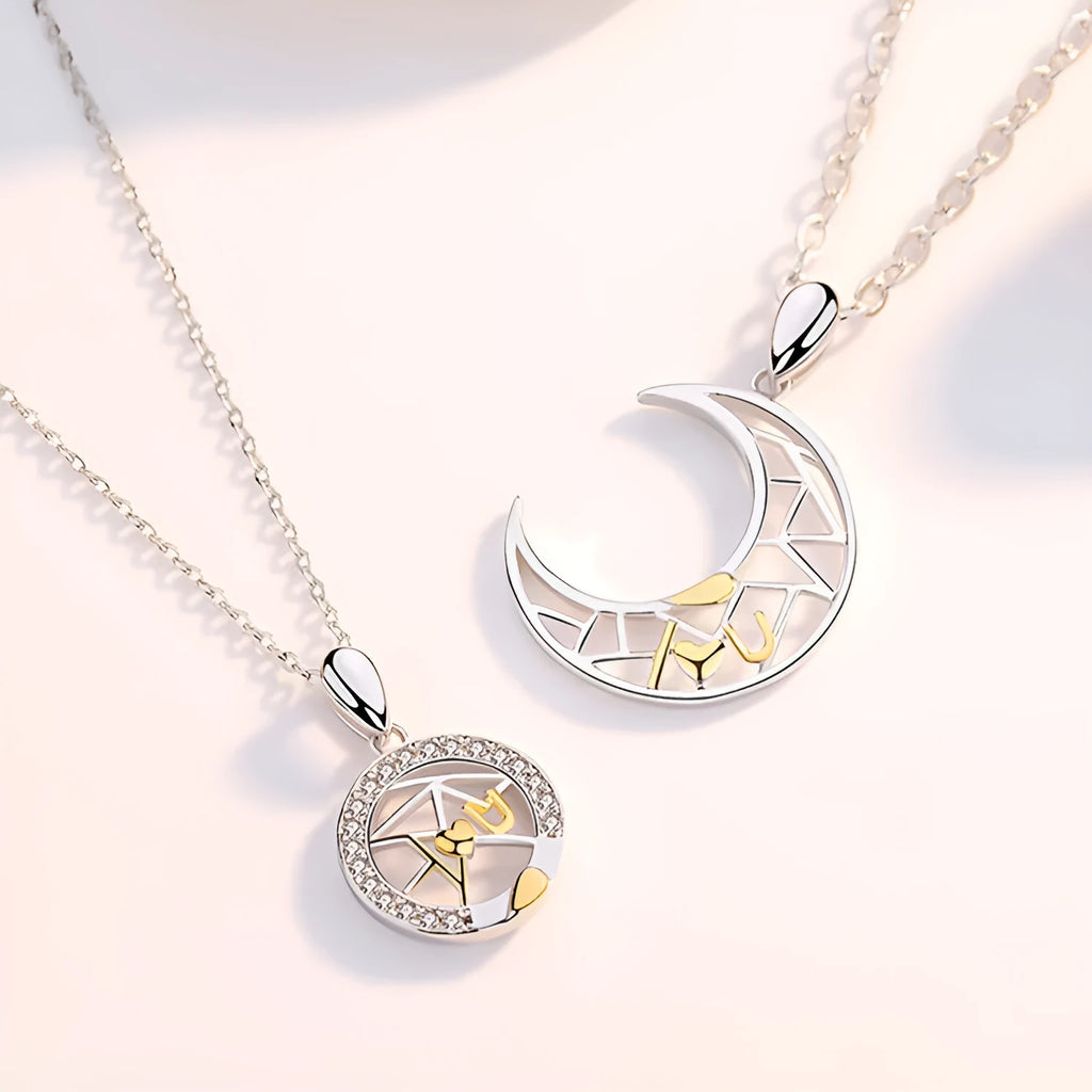 Copper sun and moon tooth couple necklace set with electroplated finish on a cross chain.