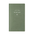 A simple portable todolist notebook in morandi blue with a PU cover, shown next to a pen.
