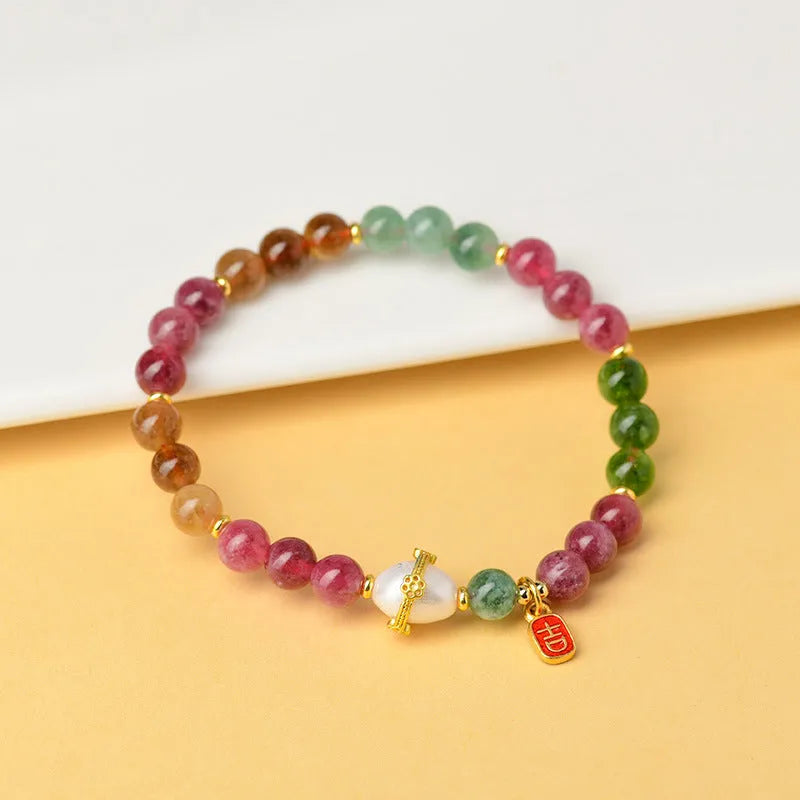 Geometric chalcedony bracelet with 6.5mm beads and natural crystal construction