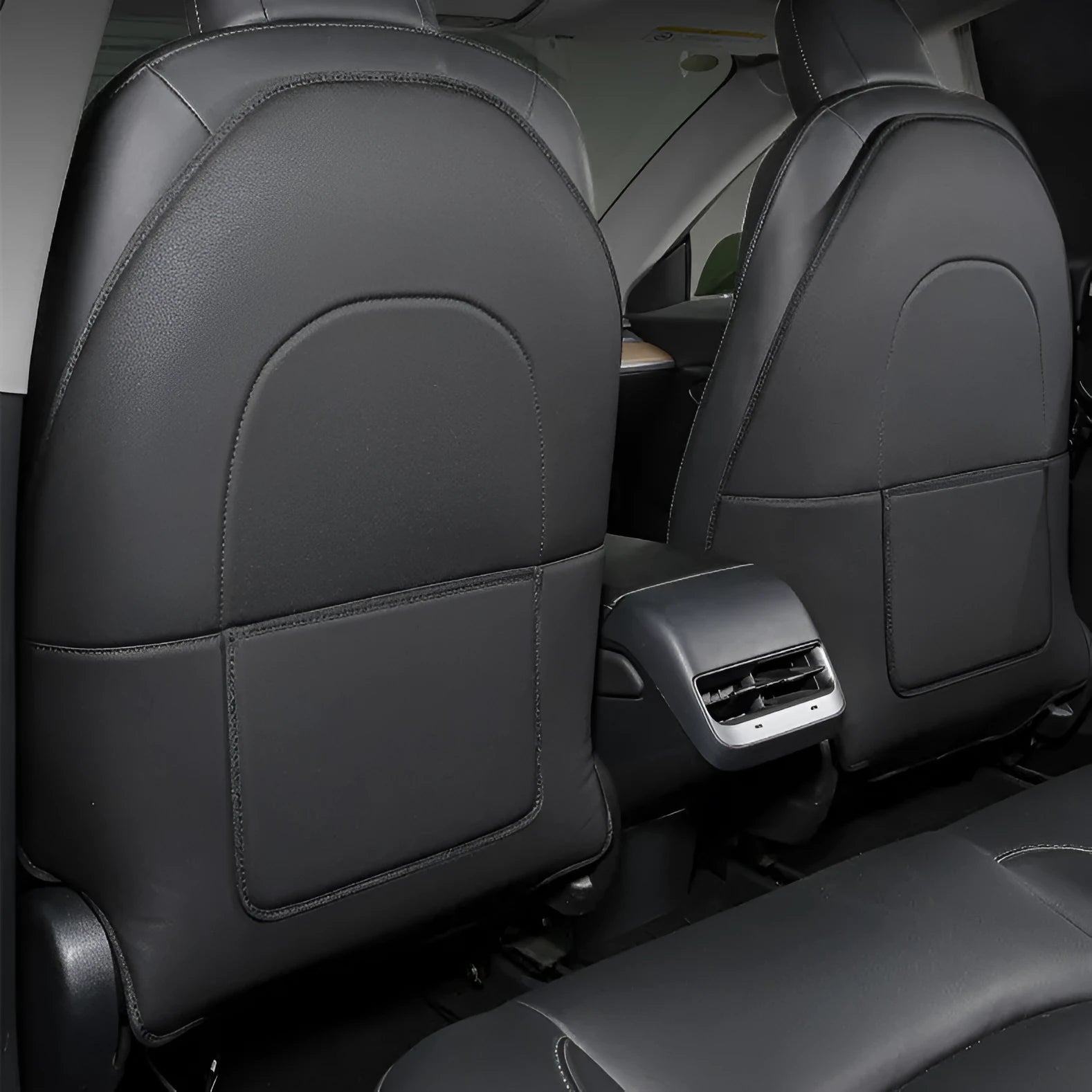 Black leather rear anti kick pad for car seats with a single pocket, shown alongside a tape measure indicating 68cm by 42cm dimensions.