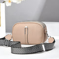 Soft PU leather women's oval crossbody bag showing slit pocket and internal organiser compartments