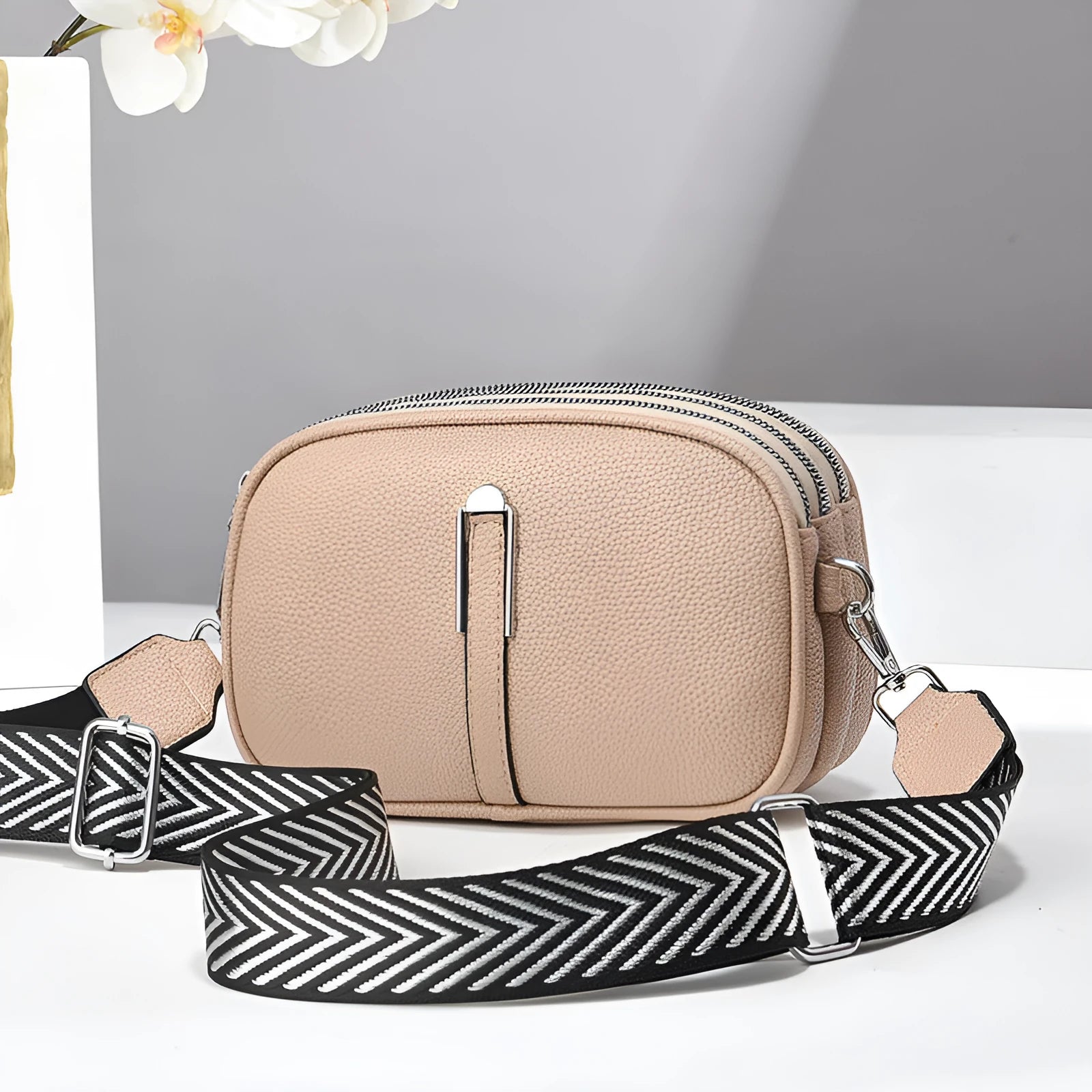 Soft PU leather women's oval crossbody bag showing slit pocket and internal organiser compartments