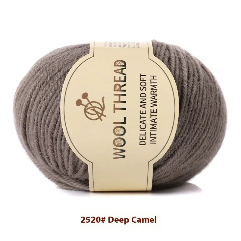 A roll of hand knitting wool thread in a choice of colours for baby sweater projects.