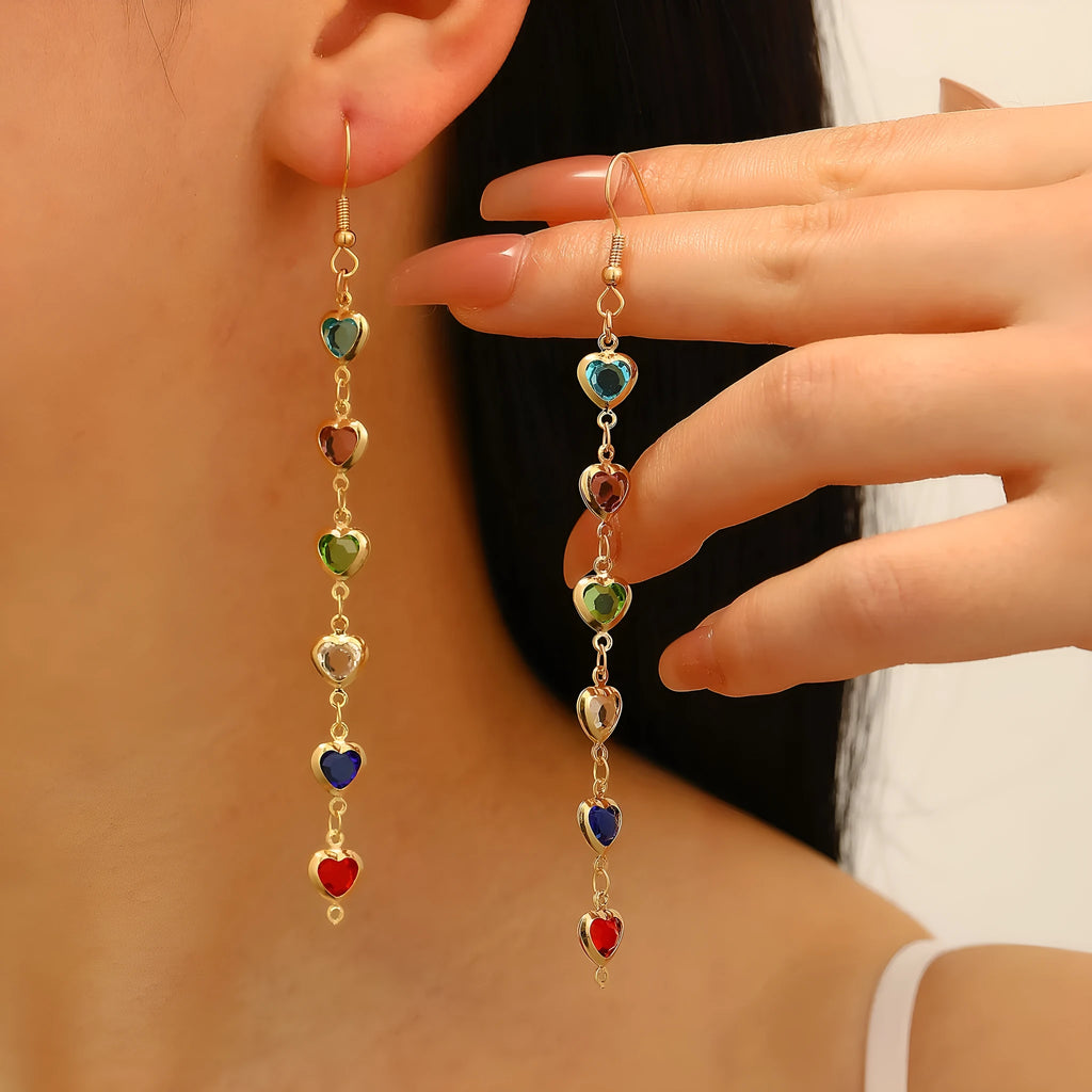 Women's colourful water drop tassel earrings in gold-tone electroplated copper on a plain background