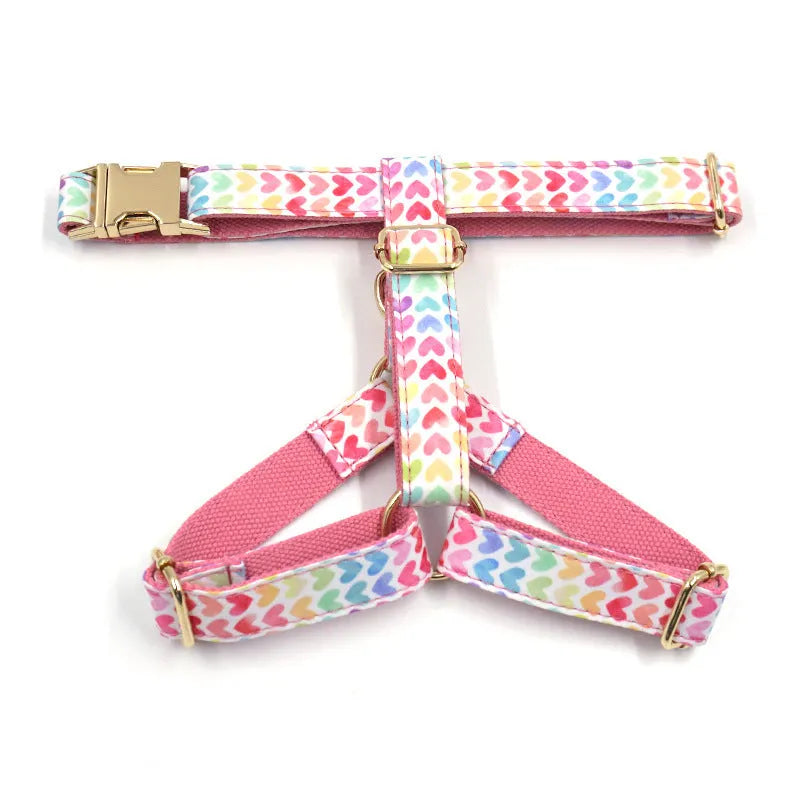 Pink dog harness with gold buckle and colourful heart-shaped stone decoration