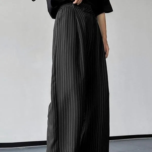 Men's black vertical striped pleated casual trousers showing front design and fabric texture