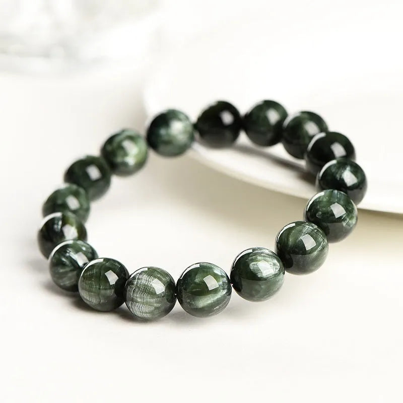 Green Dragon Crystal bracelet with round beads featuring Ruyi design elements.