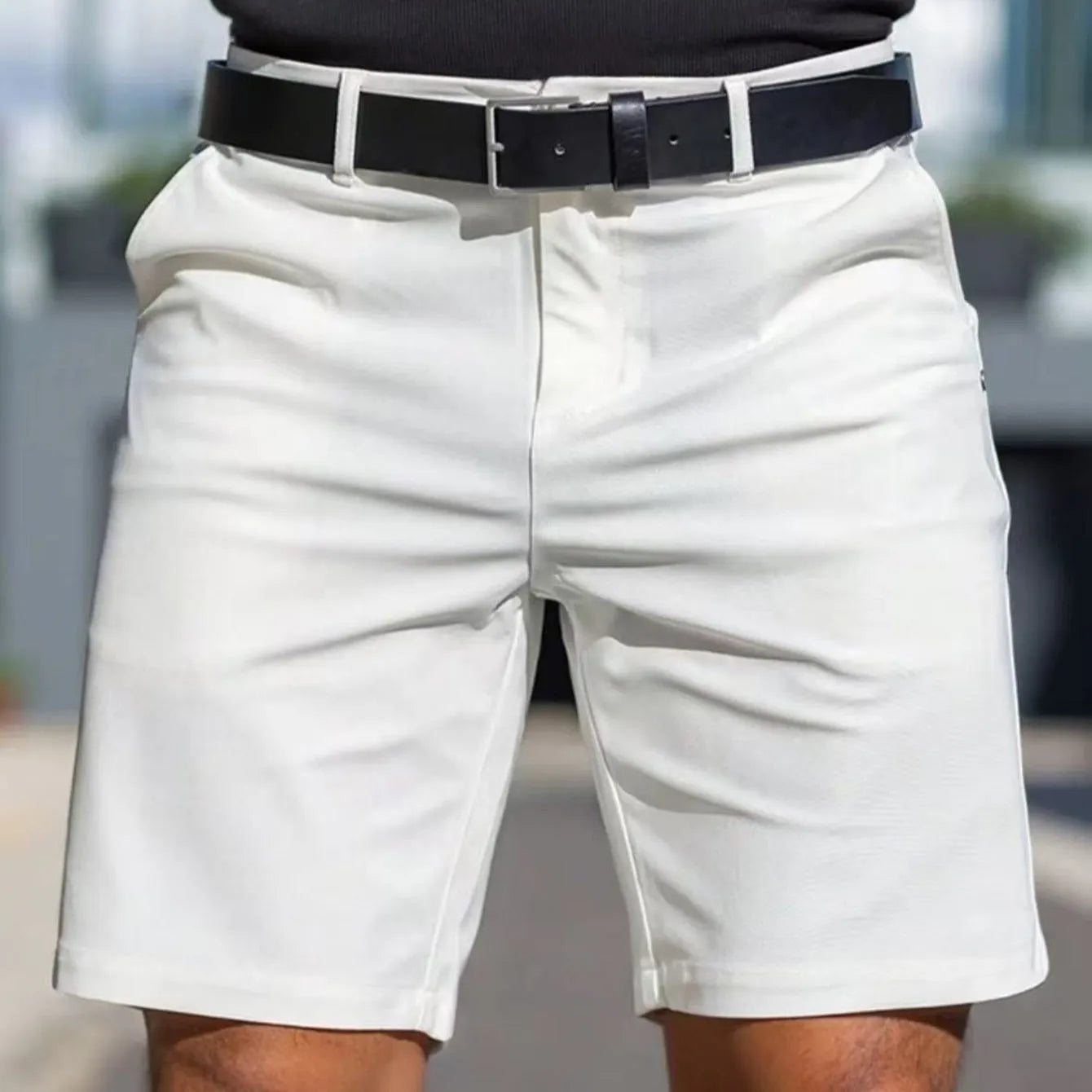 Men's solid colour straight-leg fifth pants in micro-elastic polyester fabric on a hanger.