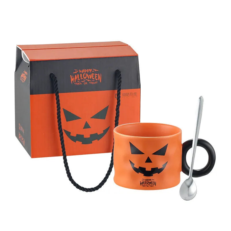 Orange ceramic Halloween pumpkin mug with handle and dessert spoon in gift box packaging