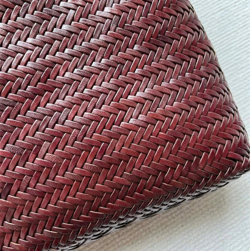 Brown woven leather tote bag with three-dimensional pocket and shoulder strap