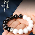 Black and white obsidian bodhi seed taiji bracelet with geometric beads and mantra engraving