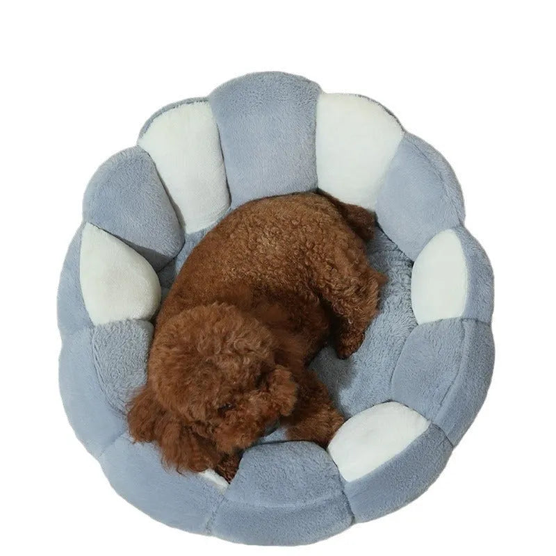 Greyish-white rabbit fur lined pet shell nest bed for cats and small dogs in three sizes.